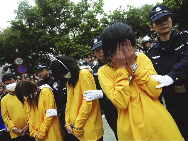 police officers watch over prostitutes during a public parade in shenzhen south china 039 s guangdong province photo reuters file police officers watch over prostitutes during a public parade in shenzhen south china 039 s guangdong province photo reuters file