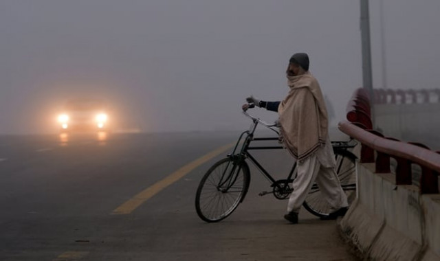 dense fog is likely to prevail in islamabad most plain areas of punjab and upper sindh on monday photo afp file dense fog is likely to prevail in islamabad most plain areas of punjab and upper sindh on monday photo afp file