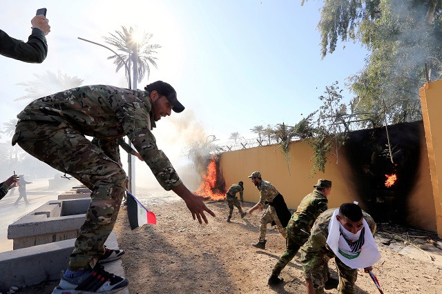 violent protests erupt around us embassy in baghdad after us air strikes violent protests erupt around us embassy in baghdad after us air strikes