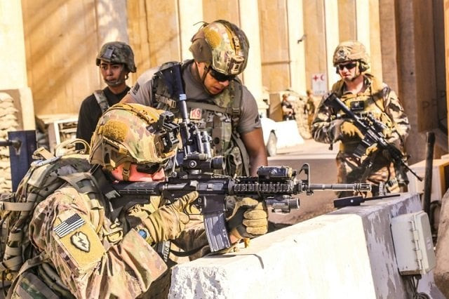 american soldiers take positions around the united states embassy in baghdad iraq after supporters and members of the hashed al shaabi military network breached the outer wall of the mission photo afp american soldiers take positions around the united states embassy in baghdad iraq after supporters and members of the hashed al shaabi military network breached the outer wall of the mission photo afp