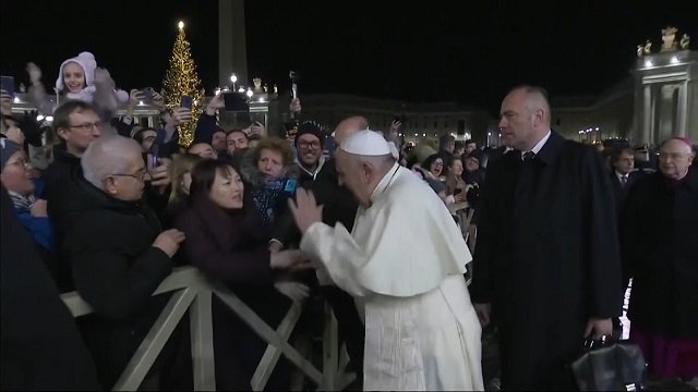 watch angry pope slaps hand of woman who refuses to let go