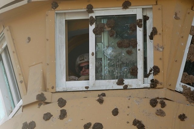 a us army soldier is seen at a watchtower of the us embassy during a protest to condemn air strikes on bases belonging to hashd al shaabi paramilitary forces in baghdad iraq january 1 2020 reuters khalid al mousily