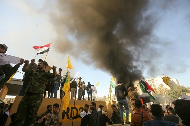 pro iran demonstrators marched unimpeded through baghdad 039 s usually high security green zone and stormed the us embassy photo afp