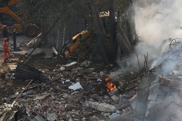 rescue workers look at the site of a fire and building collapse at a factory in new delhi on january 2 2020 photo afp rescue workers look at the site of a fire and building collapse at a factory in new delhi on january 2 2020 photo afp