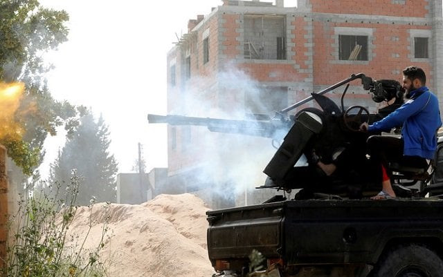 a member of the libyan gna forces fires during a fight with eastern forces in ain zara tripoli libya photo reuters a member of the libyan gna forces fires during a fight with eastern forces in ain zara tripoli libya photo reuters