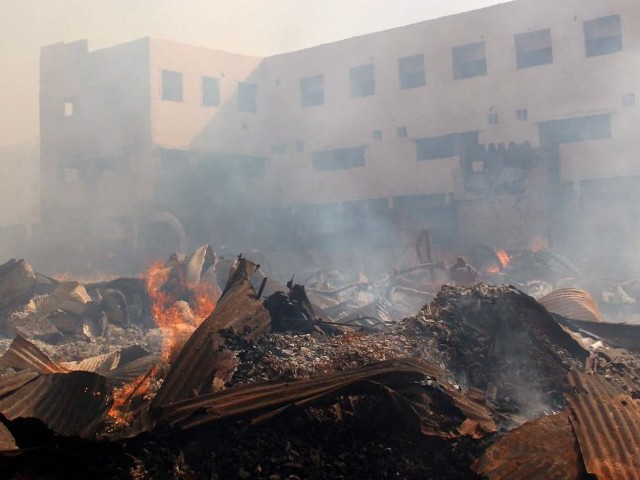 quot if the fire extinguishers had arrived on time and had adequate water this fire could have been controlled quot said a shopkeeper abdul qadir photo file