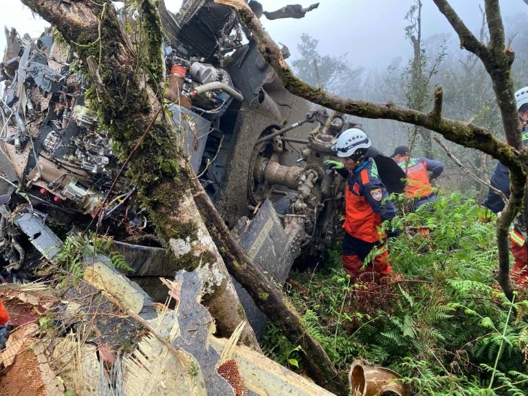 rescuers searching for survivors after a military black hawk helicopter smashed into mountains in yilan county near taipei photo afp