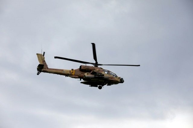 an israeli army helicopter flies over the annexed golan heights photo afp