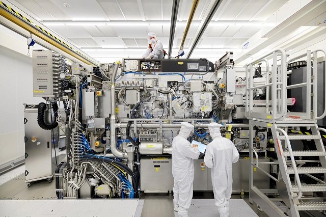 employees are seen working on the final assembly of asml 039 s twinscan nxe 3400b semiconductor lithography tool with its panels removed in veldhoven netherlands in this picture taken april 4 2019 photo reuters