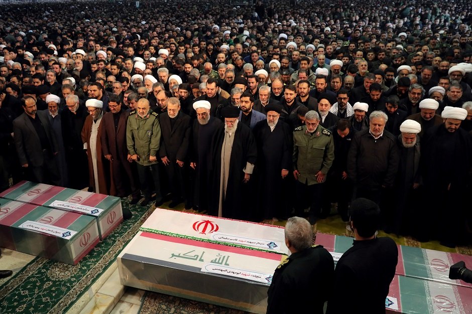 iran 039 s supreme leader ayatollah ali khamenei and iranian president hassan rouhani pray near the coffins of iranian major general qassem soleimani head of the elite quds force and iraqi militia commander abu mahdi al muhandis who were killed in an air strike at baghdad airport in tehran iran january 6 2020 photo reuters