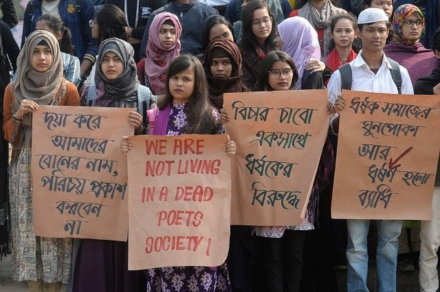dhaka university students hold placards as they take part in a rally to demand punishment for the people involved in the rape case of a female student of of dhaka university photo afp dhaka university students hold placards as they take part in a rally to demand punishment for the people involved in the rape case of a female student of of dhaka university photo afp
