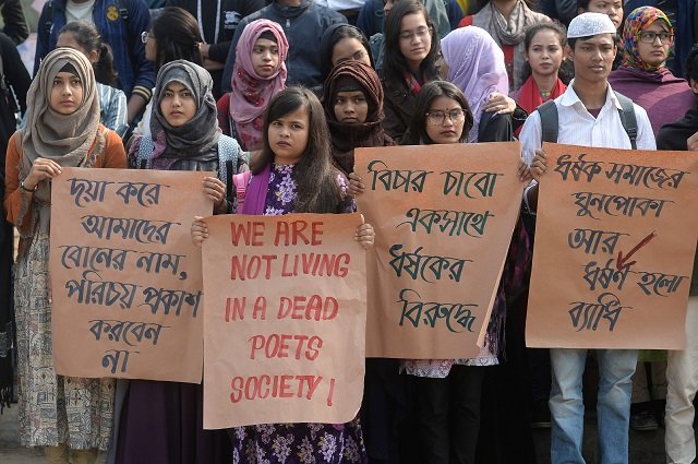 dhaka university students hold placards as they take part in a rally to demand punishment for the people involved in the rape case of a female student of of dhaka university photo afp