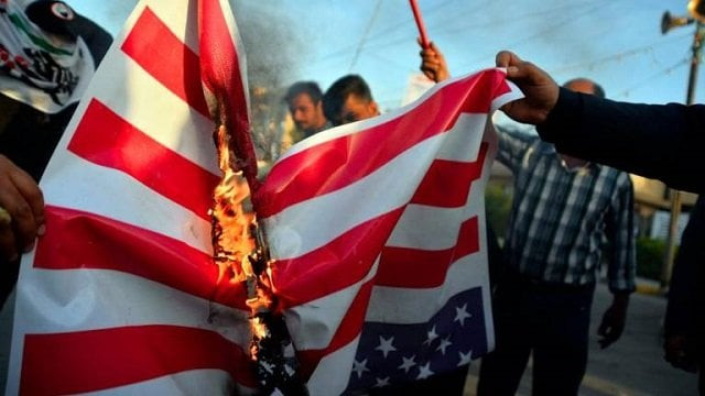 iraqis burn a us national flag on dec 30 during a demonstration to denounce the previous night 039 s attacks by us planes on several bases belonging to the hezbollah brigades near al qaim an iraqi district bordering syria photo afp file