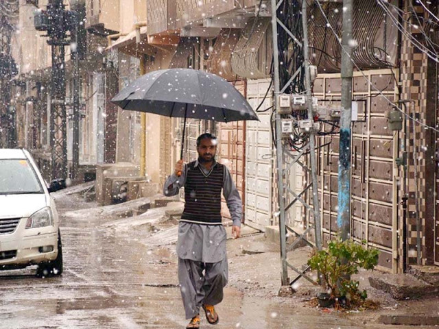 a man walks in snowfall in quetta photo inp a man walks in snowfall in quetta photo inp