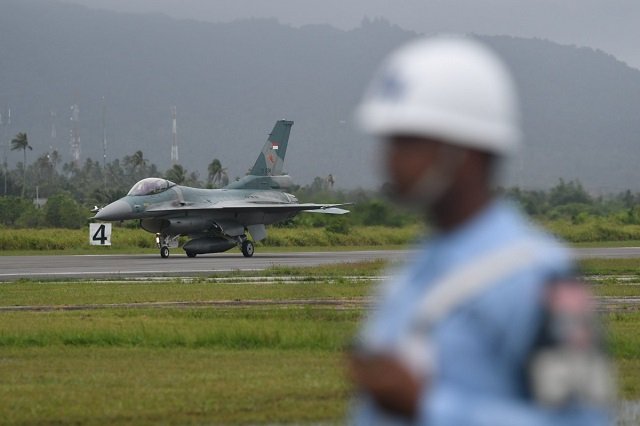 an f 16 c fighter jet arrives at raden sadjad military airbase on natuna island photo reuters