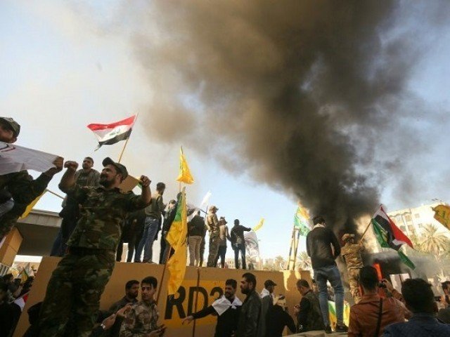 pro iran demonstrators marched unimpeded through baghdad 039 s usually high security green zone and stormed the us embassy photo afp