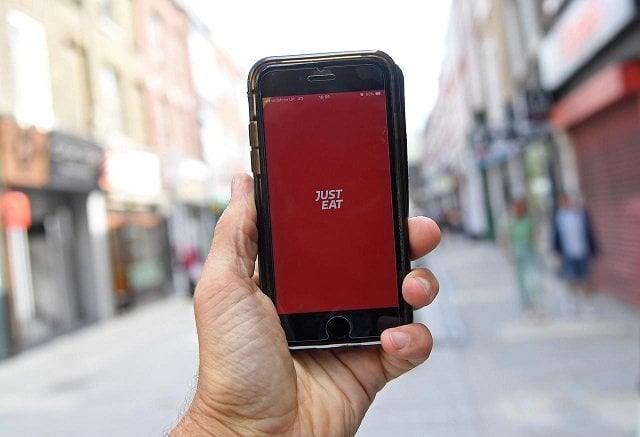 the app for just eat is displayed on a smartphone in this posed picture in london britain august 5 2019 photo reuters