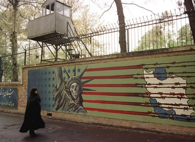 a file photo taken on november 03 1999 shows an iranian woman walking past an anti us mural at the former us embassy in tehran photo afp a file photo taken on november 03 1999 shows an iranian woman walking past an anti us mural at the former us embassy in tehran photo afp