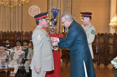 president dr alvi confers nishan e imtiaz on general nadeem raza