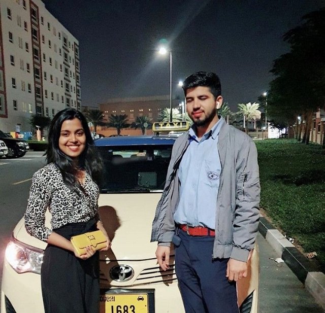 a jubilant raechel rose poses for a photo with modassar khadim after handed over her lost wallet at her community in dubai in the wee hours of sunday photo courtesy gulf news