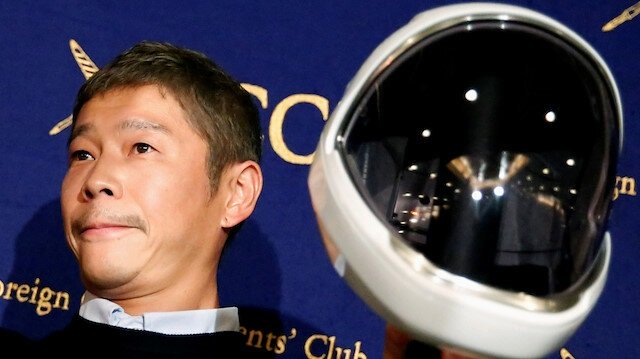 japanese billionaire yusaku maezawa founder and chief executive of online fashion retailer zozo who has been chosen as the first private passenger by spacex poses for photos as he attends a news conference at the foreign correspondents 039 club of japan in tokyo japan photo reuters file