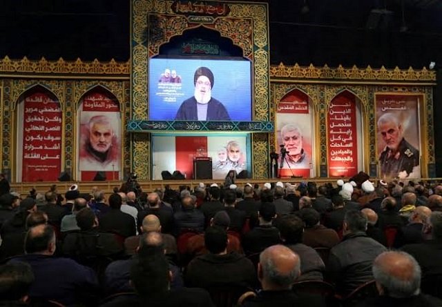 lebanon 039 s hezbollah leader sayyed hassan nasrallah addresses his supporters via a screen during a funeral ceremony rally to mourn qassem soleimani photo reuters file