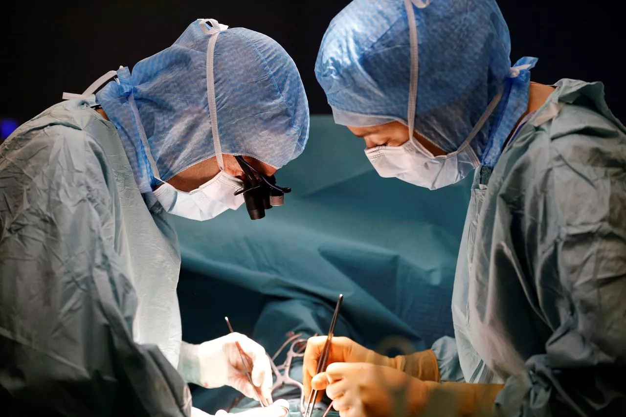 a reuters file photo of surgeons performing surgery a reuters file photo of surgeons performing surgery
