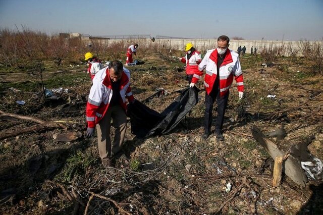 rescue team carries a body at the site where the ukraine international airlines plane crashed after take off from iran 039 s imam khomeini airport on the outskirts of tehran iran january 8 2020 photo reuters