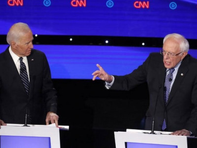 sanders and biden clash on foreign policy trade in debate in iowa