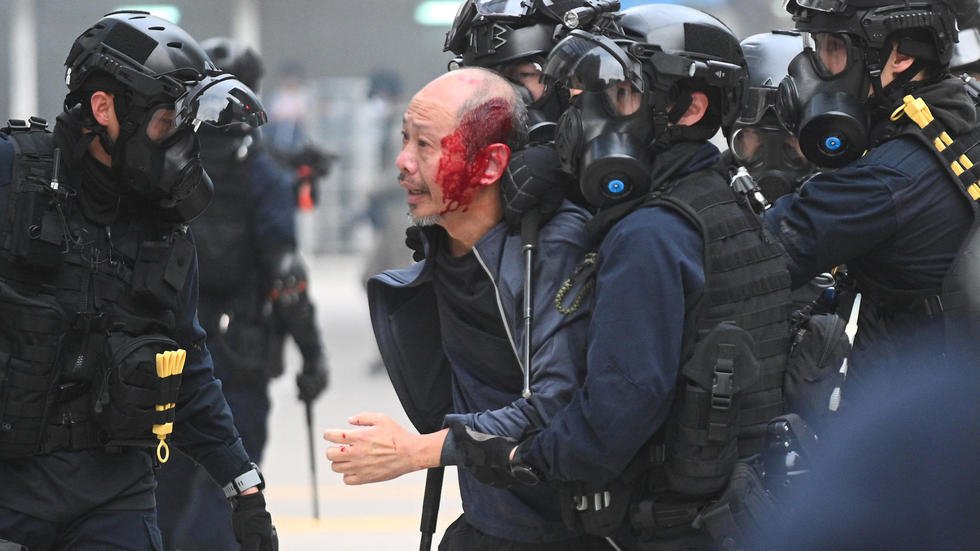 brief cat and mouse clashes ensued with police making multiple arrests including one protester who had blood streaming from the back of his head photo afp