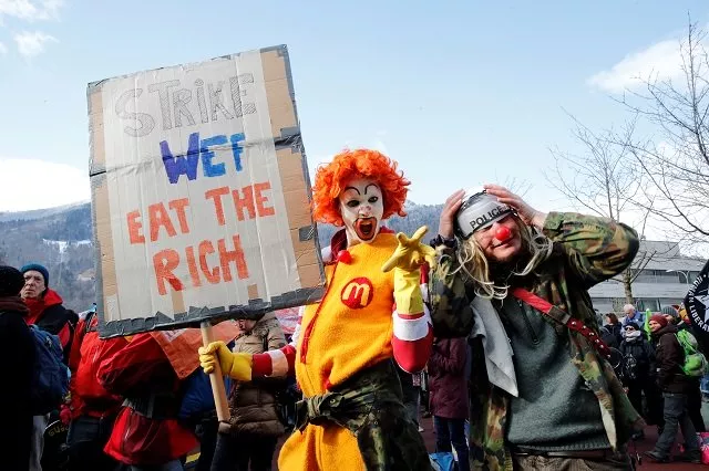 protesters wearing costumes attend a demonstration against the world economic forum wef which begins on january 21 in the town of landquart switzerland photo reuters protesters wearing costumes attend a demonstration against the world economic forum wef which begins on january 21 in the town of landquart switzerland photo reuters