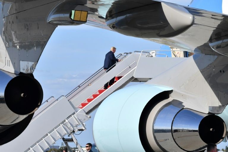 us president donald trump boards air force one at palm beach international airport in florida on january 19 2020 en route to an event in austin texas two days before his impeachment trial in the senate photo afp