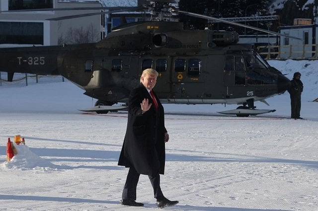 us president donald trump waves as he arrives for the 50th world economic forum wef in davos switzerland photo reuters