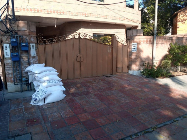 bags of flour piled up outside the residence of pml n leader photo express bags of flour piled up outside the residence of pml n leader photo express