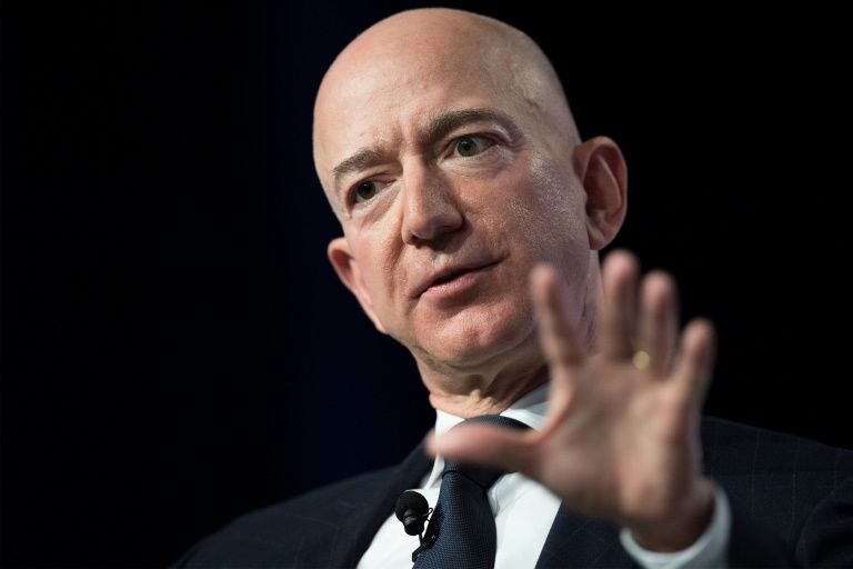 in a post on blogging platform medium thursday jeff bezos seen said enquirer publisher american media inc ami led by david pecker approached him with a threat to publish the photos if he did not halt an investigation into the motives behind that leak photo afp