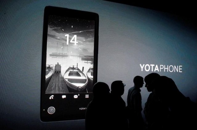 people attend a presentation ceremony for the yotaphone smartphone in moscow december 4 2013 photo reuters