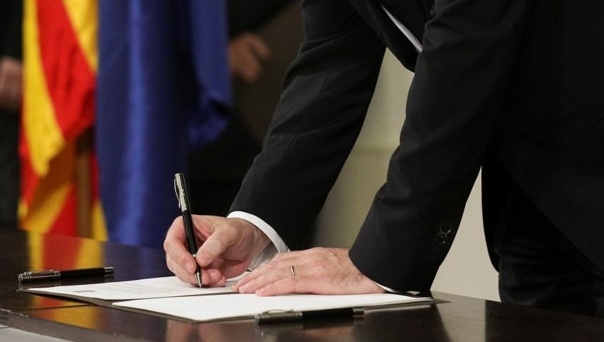 representational image of a man signing a document photo reuters