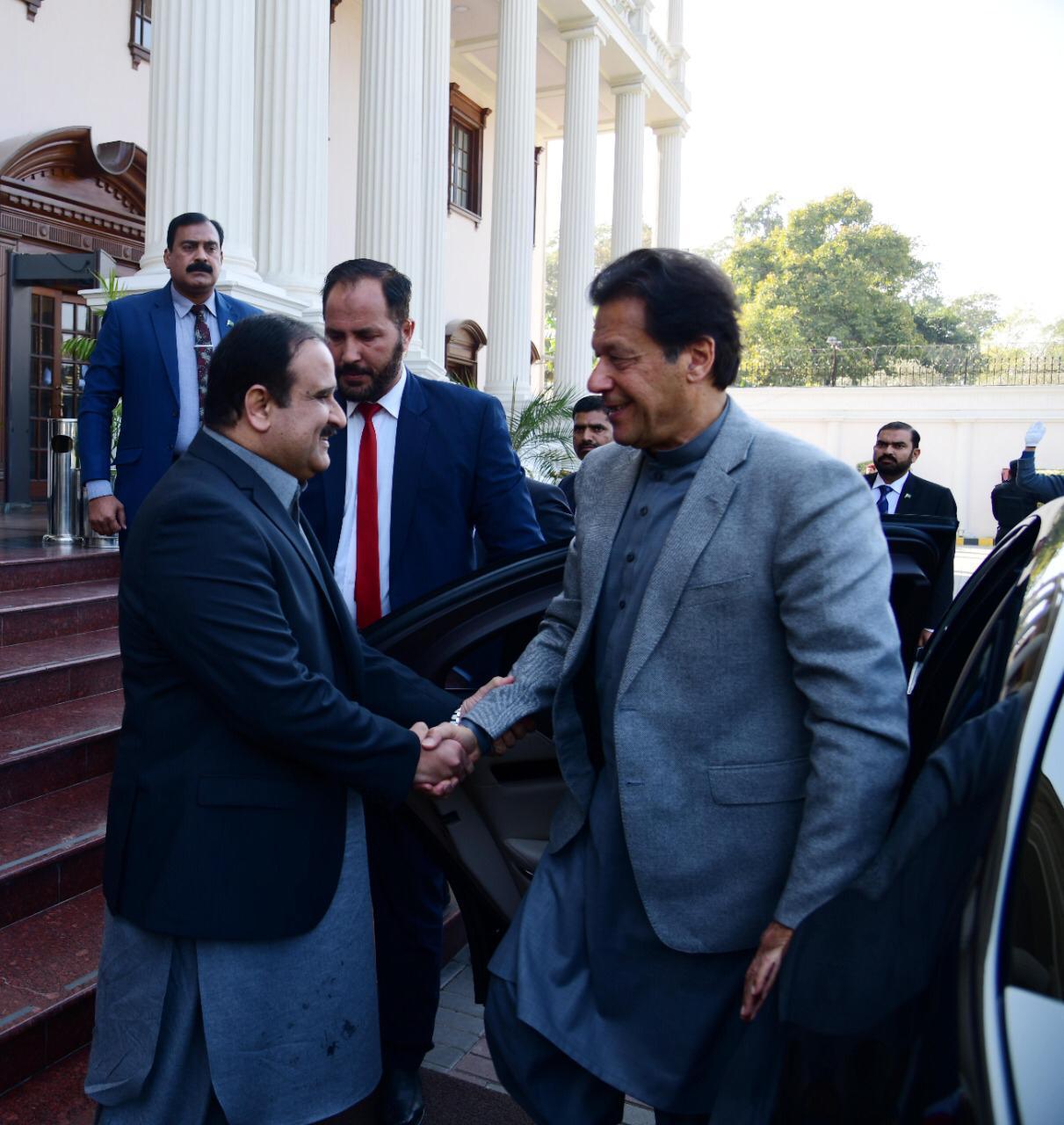 punjab cm usman buzdar greets pm imran khan at cm house photo express