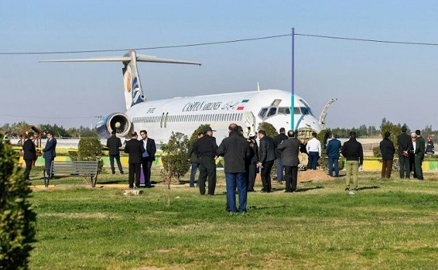 the caspian airlines mcdonnell douglas md 83 overshot the runway as it landed coming to a halt on a highway photo afp the caspian airlines mcdonnell douglas md 83 overshot the runway as it landed coming to a halt on a highway photo afp