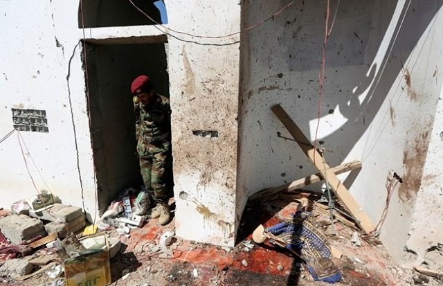 a soldier stands at the site of a houthi missile attack on a military camps mosque in marib yemen january 20 2020 photo reuters