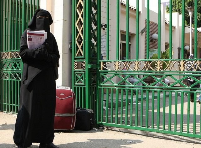 this file photo shows a woman standing outside cairo university where women staff are banned from wearing the niqab photo afp file