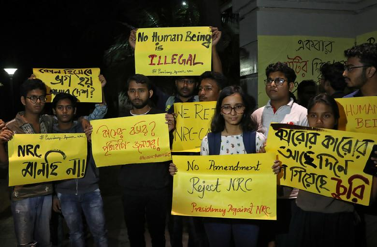 students display placards as they attend a protest against the national register of citizens nrc and the citizenship amendment bill cab photo reuters