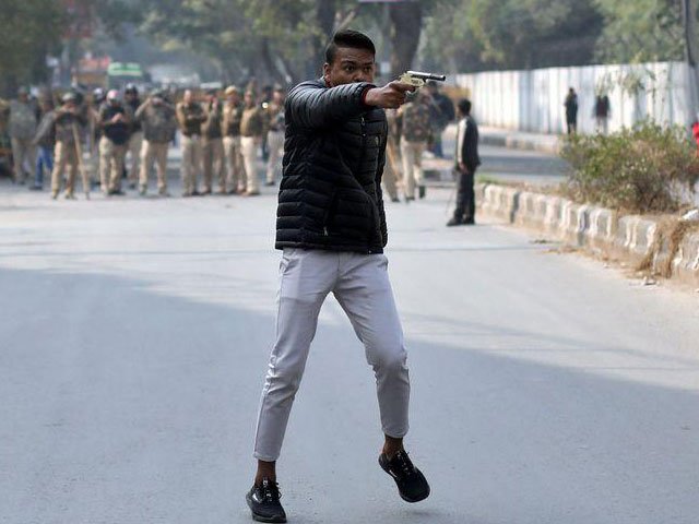 an unidentified man brandishes a gun during a protest against a new citizenship law outside the jamia millia islamia university in new delhi india january 30 2020 photo reuters