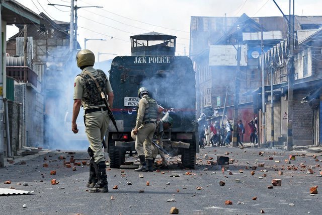 kashmiris block highway after indian army martyrs two labourers