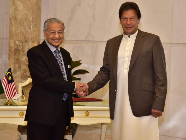 malaysian prime minister mahathir mohamad greets prime minister imran khan in putrajaya photo express