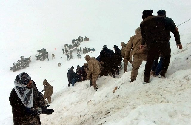 turkish soldiers and locals try to rescue people trapped under avalanche photo afp