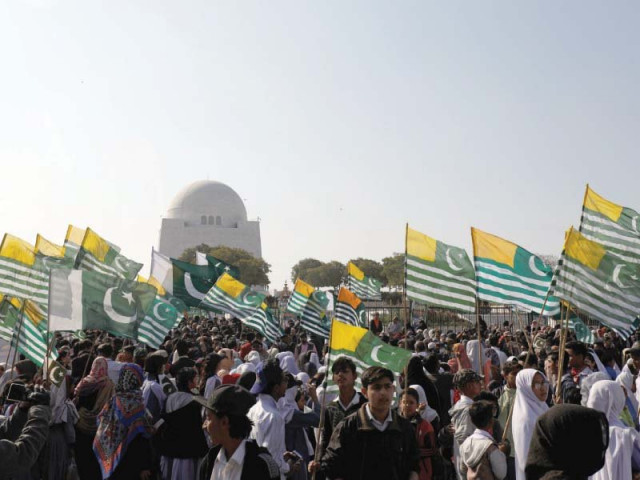 demonstrators wave kashmiri and pakistani flags during a rally at the mazar e quaid photo afp demonstrators wave kashmiri and pakistani flags during a rally at the mazar e quaid photo afp