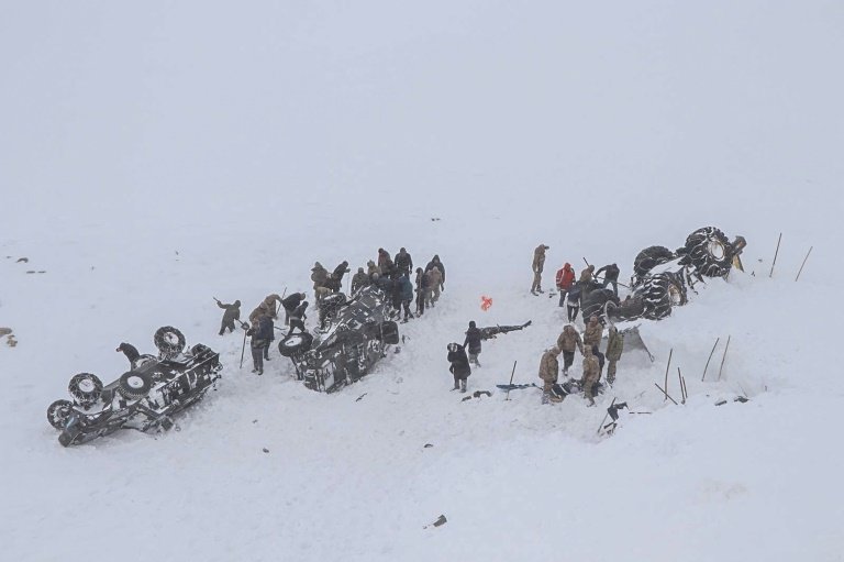 the bodies of more than two dozen rescue workers and civilians were discovered in van province where they had been helping dig out a minibus buried by a first avalanche late tuesday photo afp