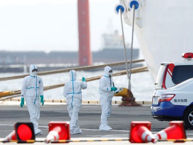 workers wearing protective gear prepare to load supplies on to the cruise ship diamond princess where 10 people on the ship had tested positive for coronavirus yesterday after it arrived at daikoku pier cruise terminal in yokohama south of tokyo japan february 6 2020 photo reuters