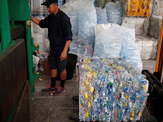 bottles for blessings thai buddhist temple recycles plastics into robes